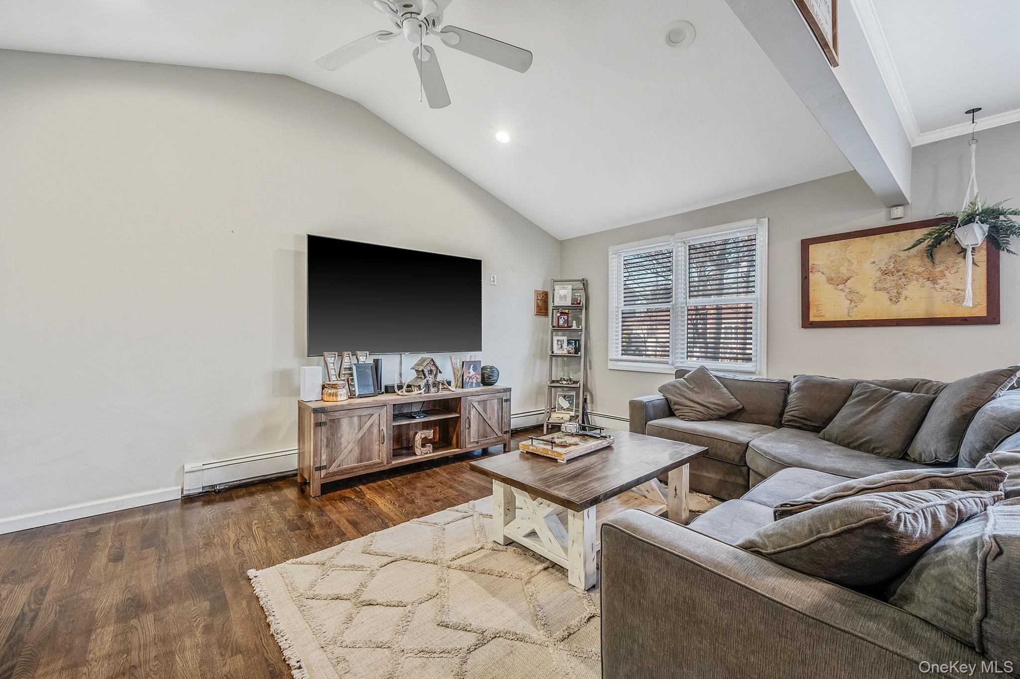 792 Frankford Road West Babylon, NY 11704 - Photo 7 of 39 a living room with furniture and a flat screen tv