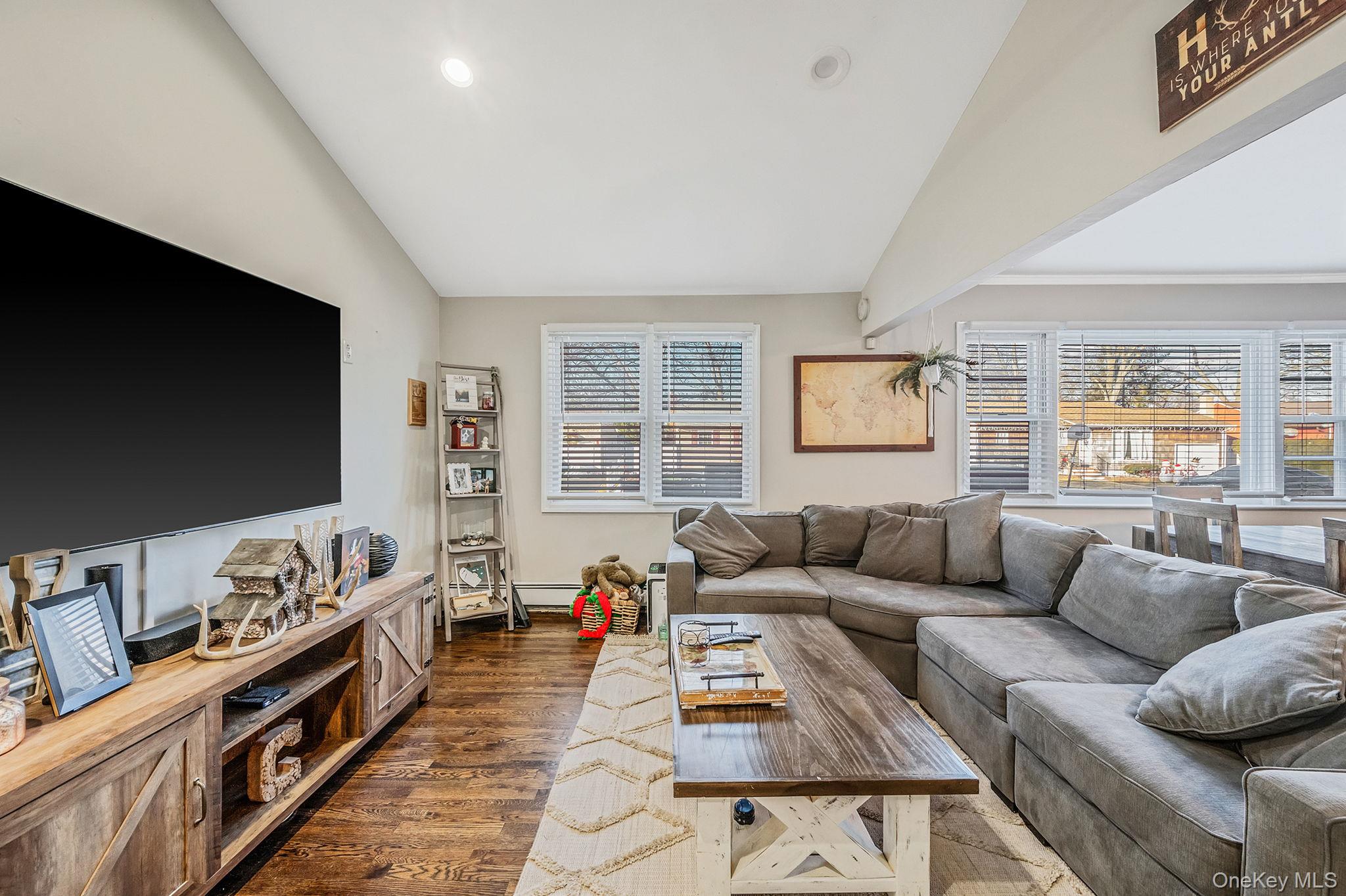 792 Frankford Road West Babylon, NY 11704 - Photo 8 of 39 a living room with furniture and a flat screen tv