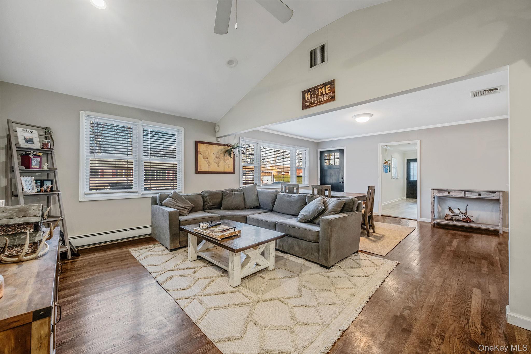 792 Frankford Road West Babylon, NY 11704 - Photo 9 of 39 a living room with furniture and a table