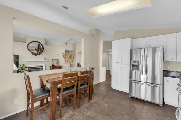 a kitchen with a table and chairs in it