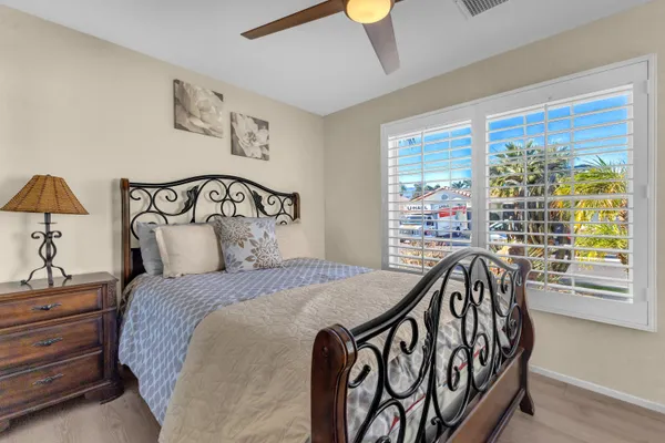 a bedroom with a bed and a table in it