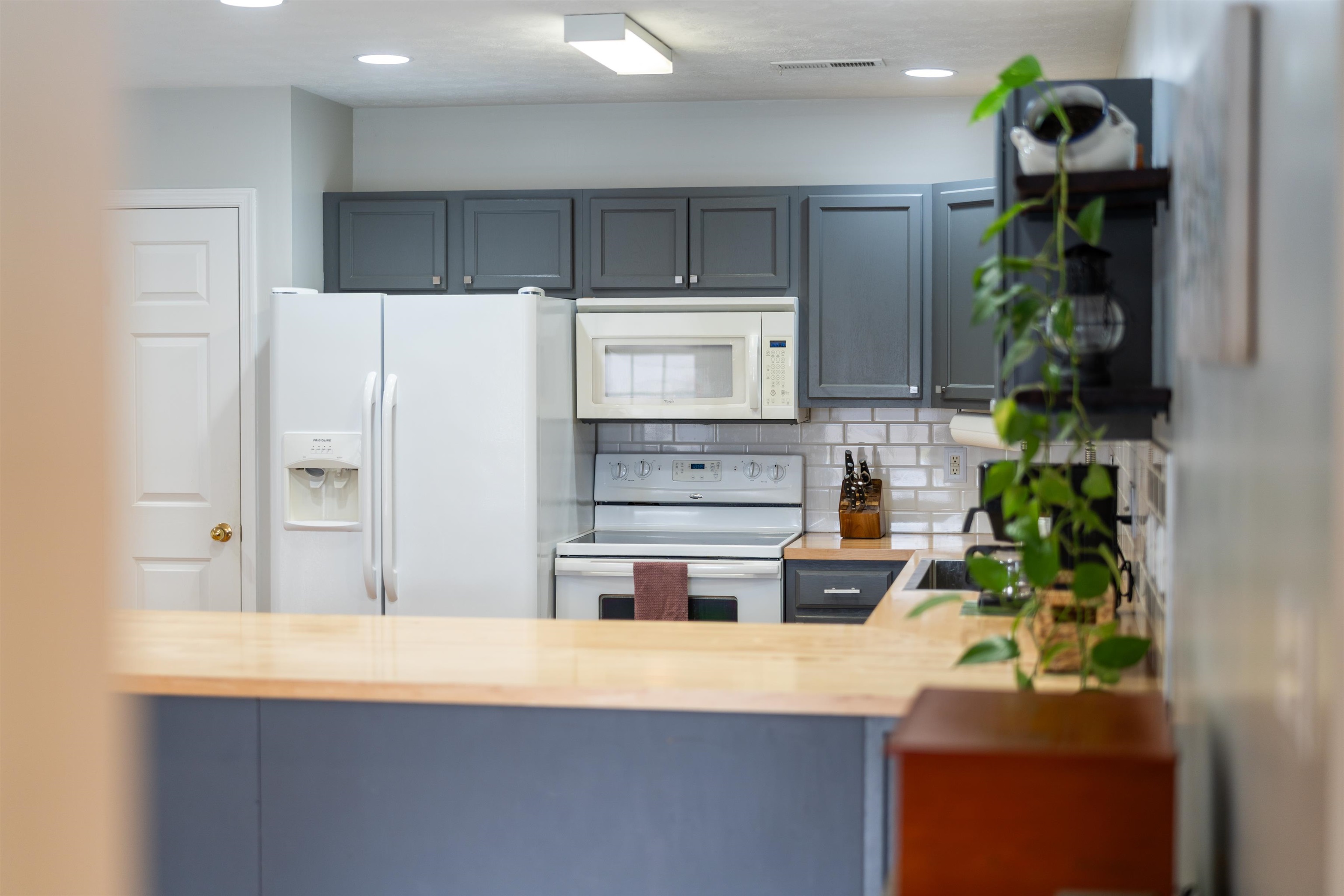 331 Stone Branch Road Staunton, VA 24401 - Photo 60 of 75 a kitchen with stainless steel appliances a stove a refrigerator a sink a counter top space and cabinets