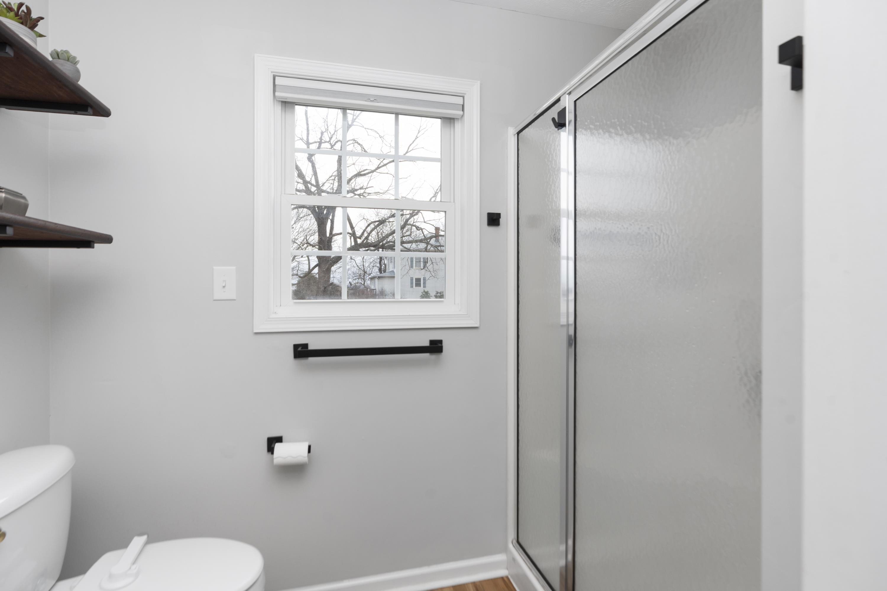 331 Stone Branch Road Staunton, VA 24401 - Photo 8 of 75 a white toilet sitting next to a bathroom sink