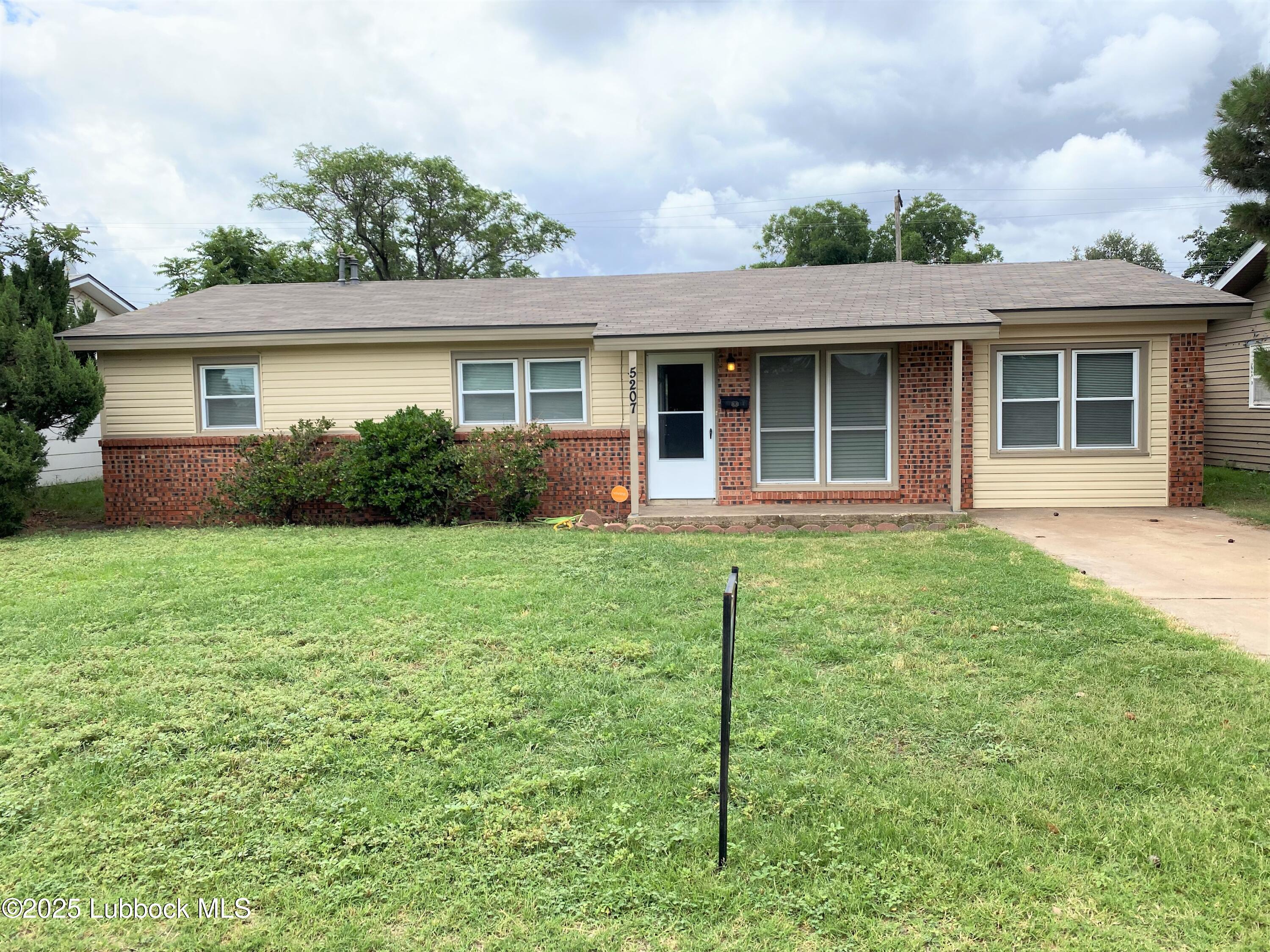 5207 39th Street Lubbock, TX 79414 - Photo 1 of 20 front view of a house and a yard