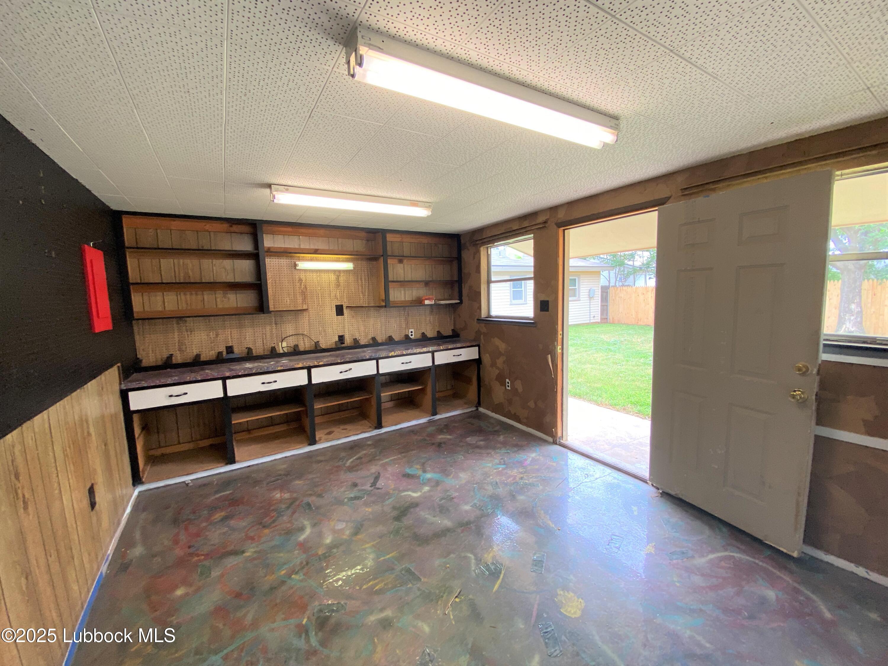 5207 39th Street Lubbock, TX 79414 - Photo 11 of 20 a large white kitchen with stainless steel appliances a large window