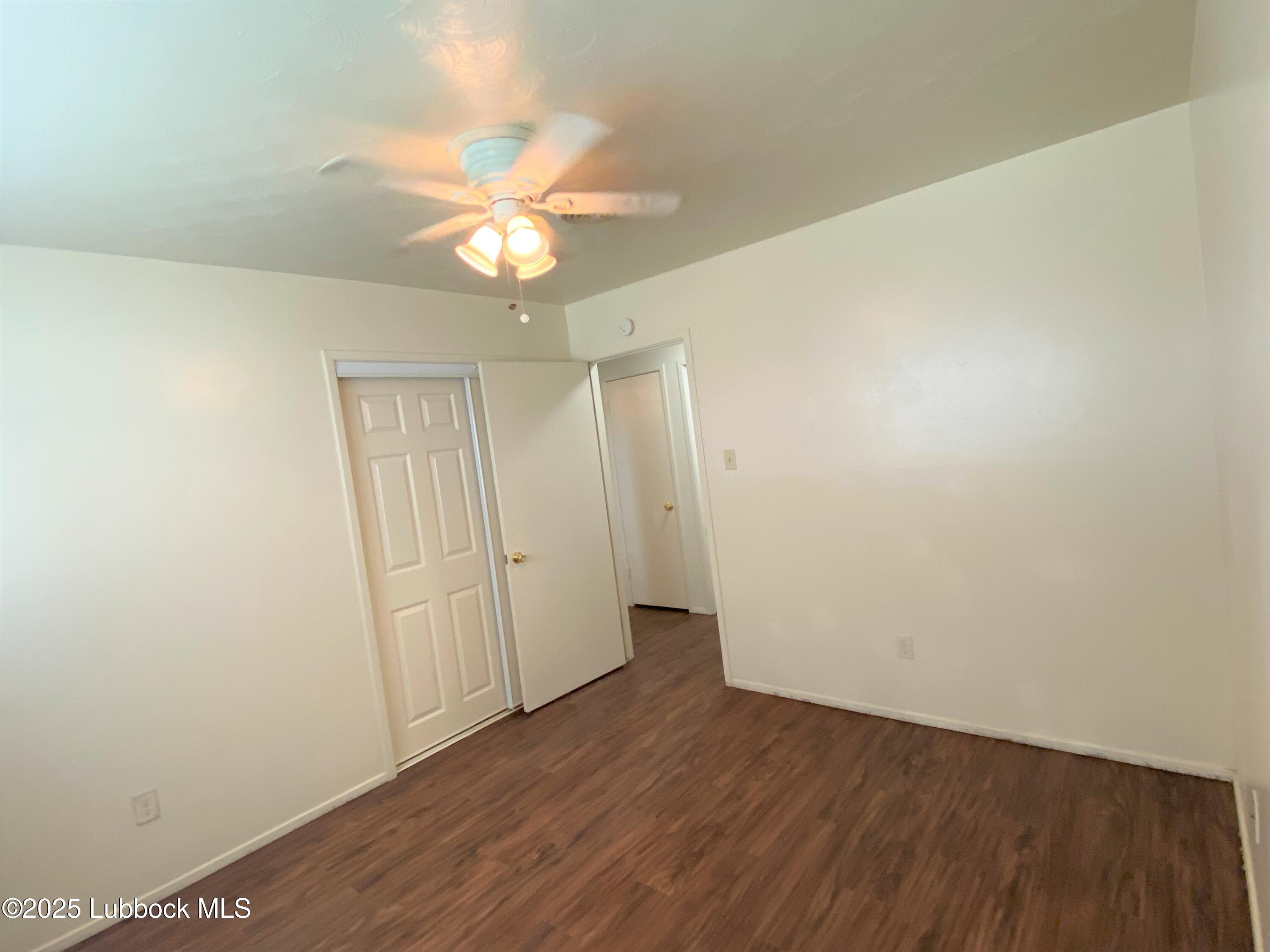 5207 39th Street Lubbock, TX 79414 - Photo 13 of 20 wooden floor in an empty room