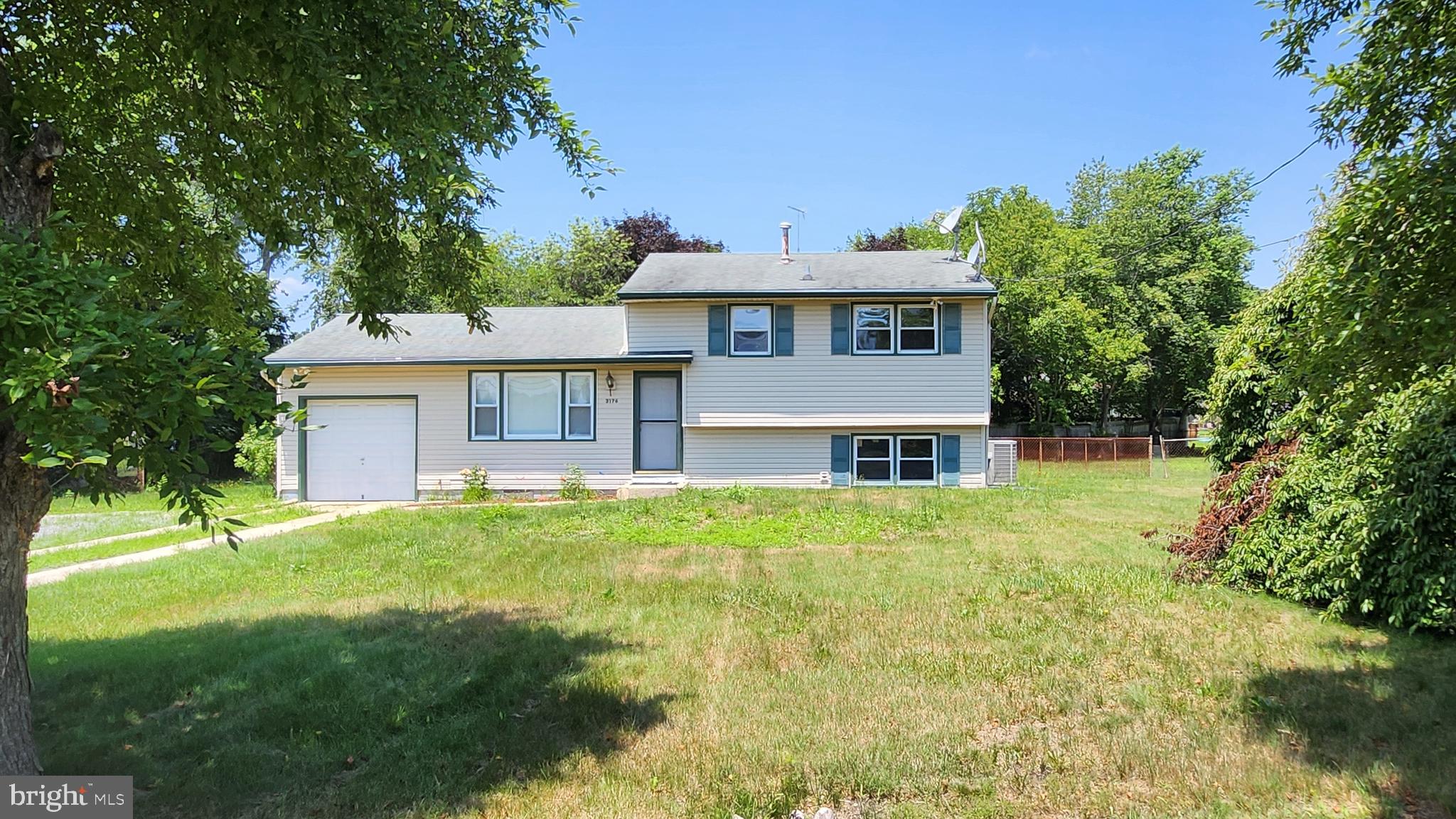 3176 Hance Bridge Road Vineland, NJ 08361 - Photo 1 of 24 a front view of a house with a yard