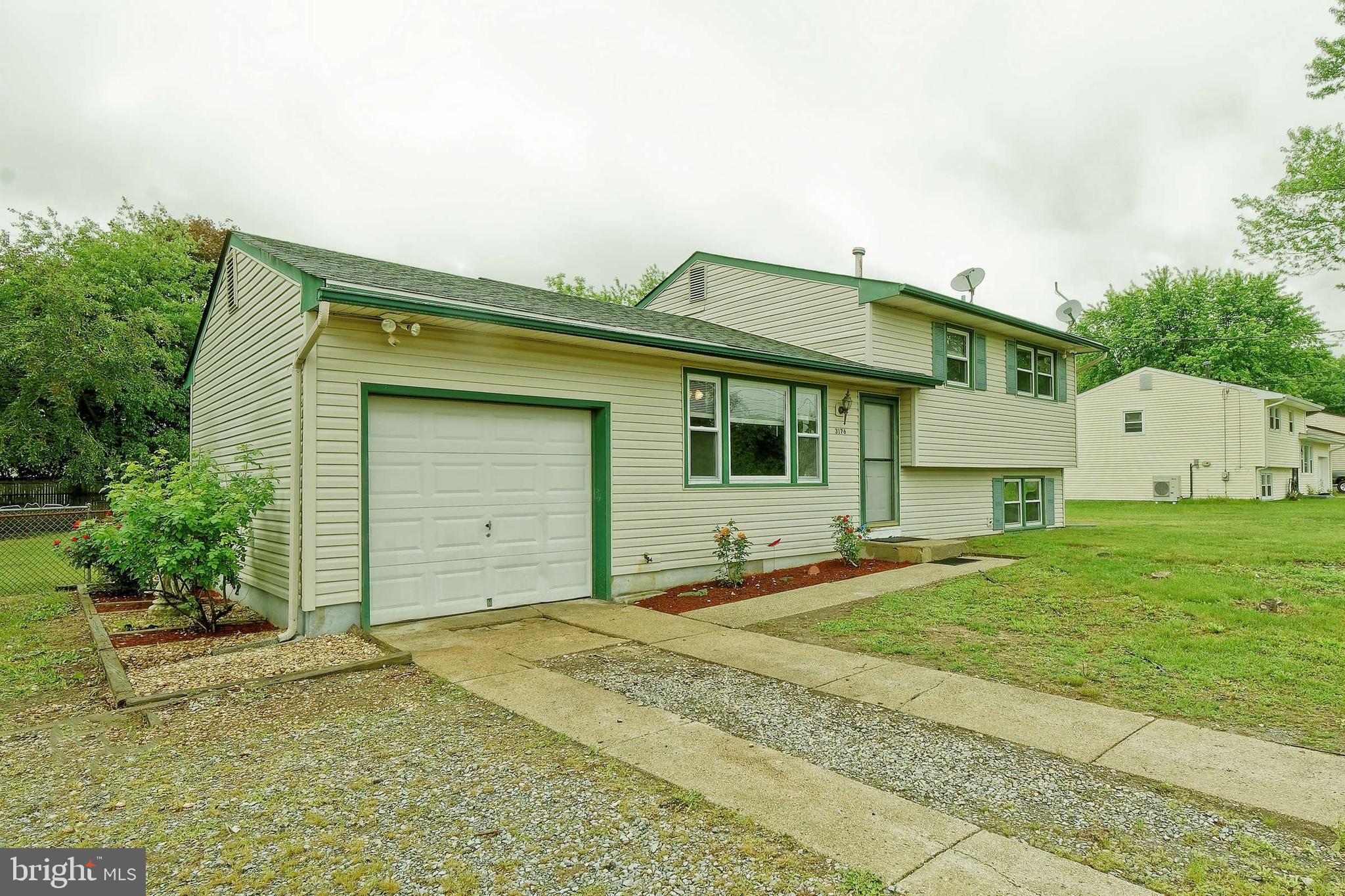 3176 Hance Bridge Road Vineland, NJ 08361 - Photo 3 of 24 a front view of a house with a yard