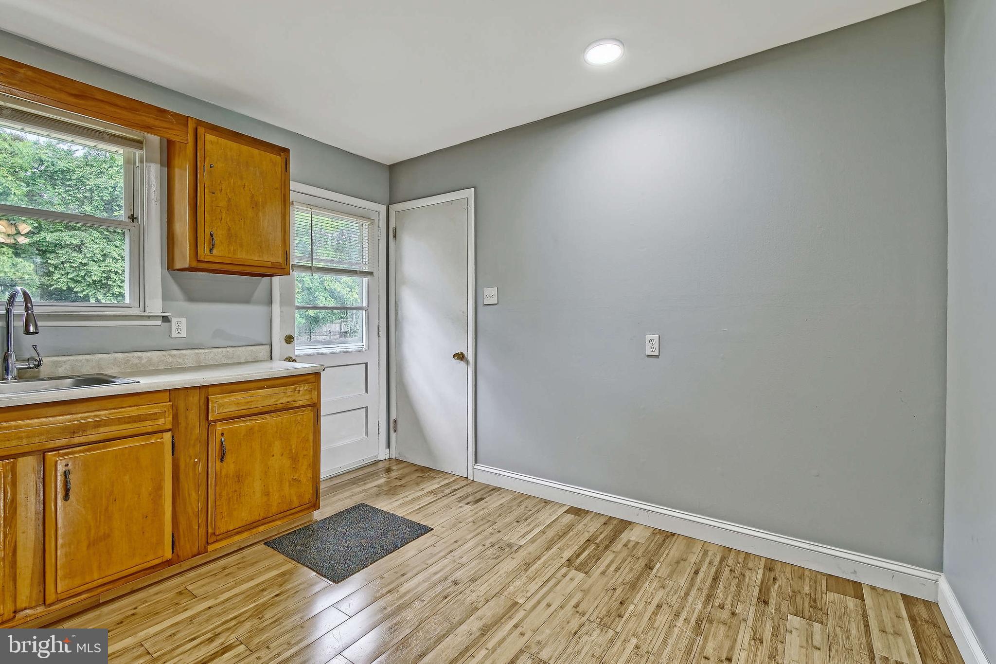 3176 Hance Bridge Road Vineland, NJ 08361 - Photo 4 of 24 a bathroom with a sink a mirror and next to a window