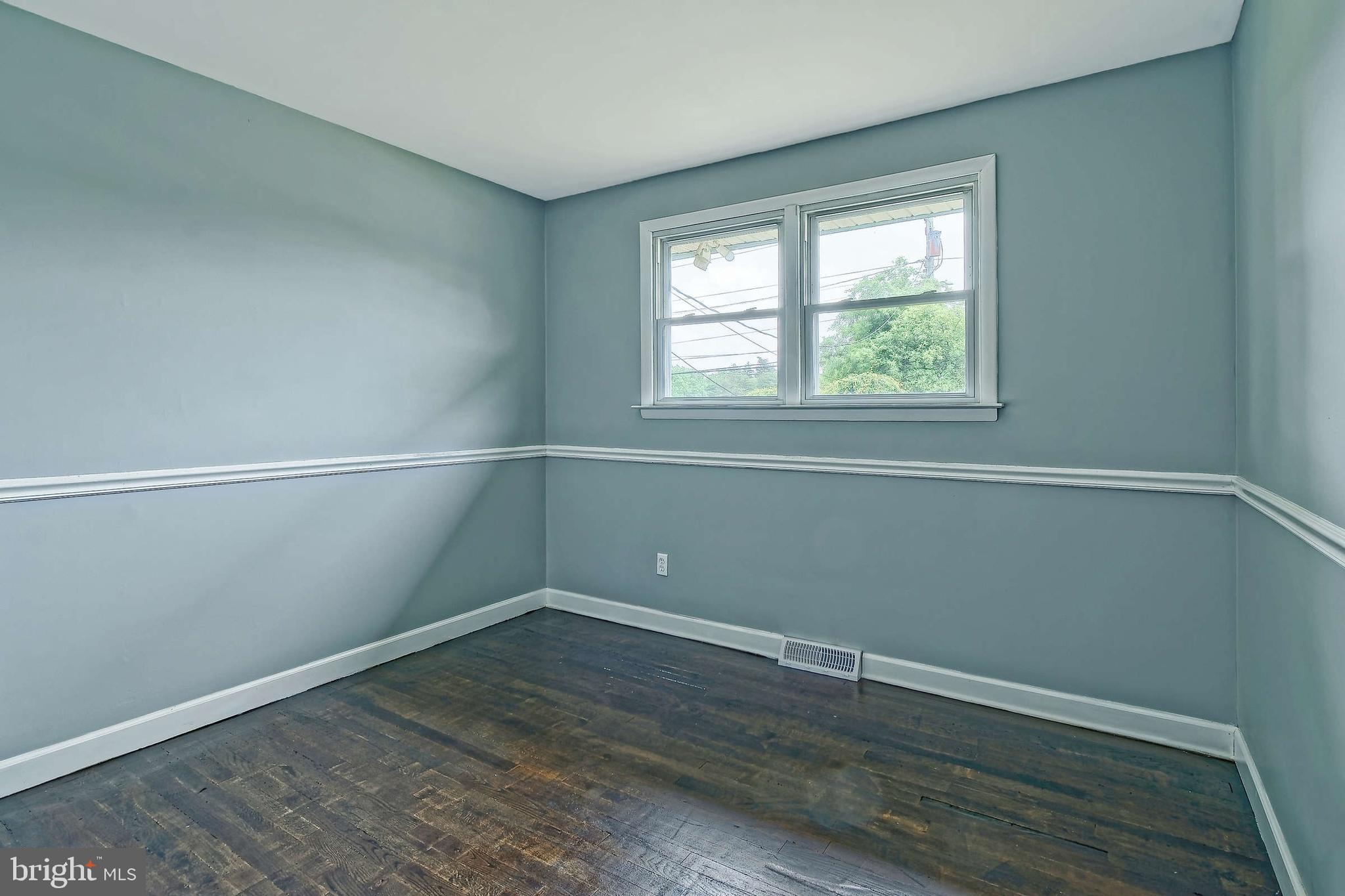 3176 Hance Bridge Road Vineland, NJ 08361 - Photo 10 of 24 wooden floor in an empty room with a window