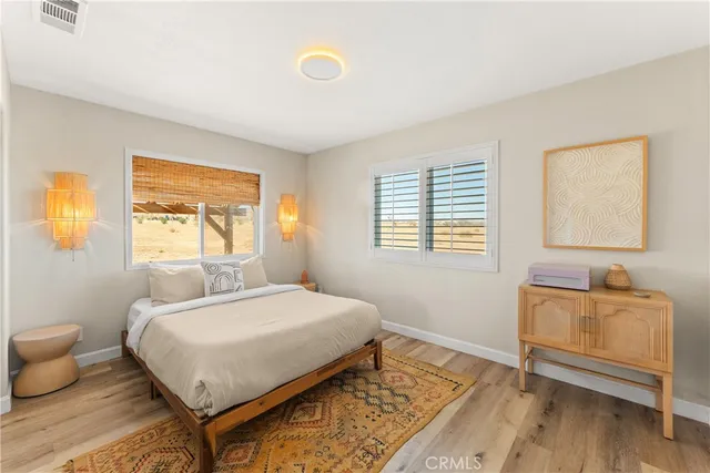 a view of a patio with table and chairs and potted plants