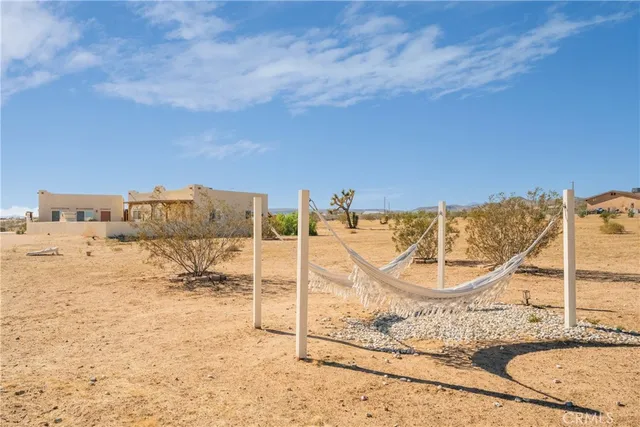 a view of a swimming pool with a lounge chairs