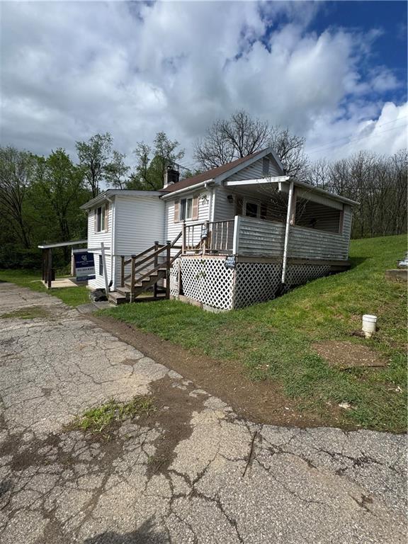 5 Navoski Lane Burgettstown, PA 15021 - Photo 2 of 3 a front view of a house with garden