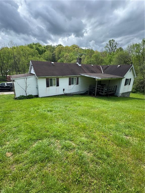 5 Navoski Lane Burgettstown, PA 15021 - Photo 3 of 3 a backyard of a house with table and chairs