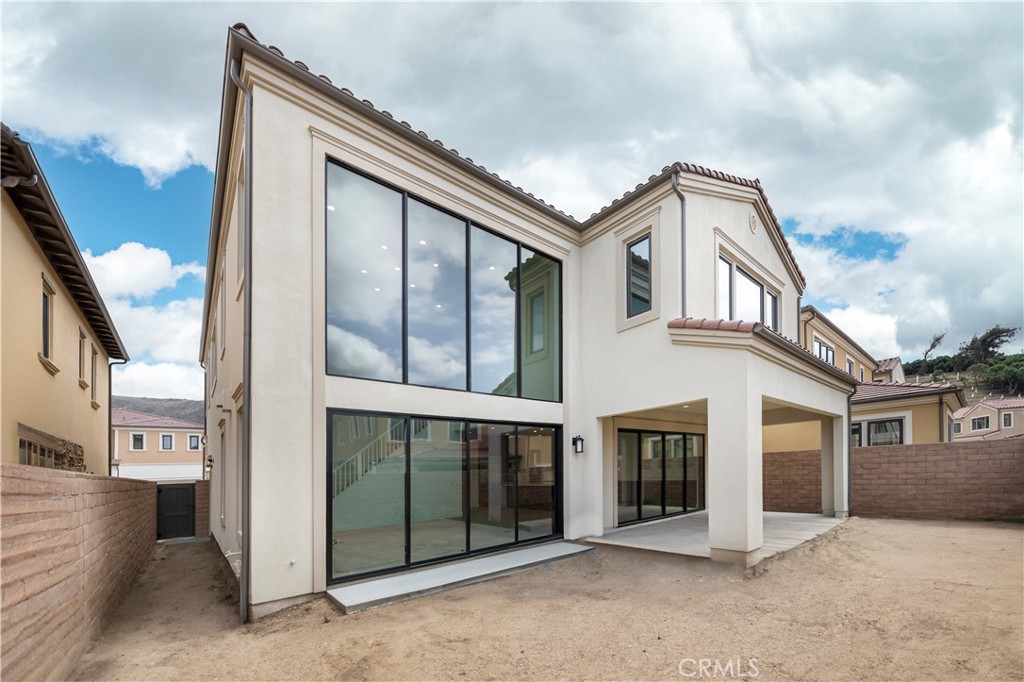 108 Coldwater Irvine, CA 92602 - Photo 24 of 36 a view of a house with a balcony and door