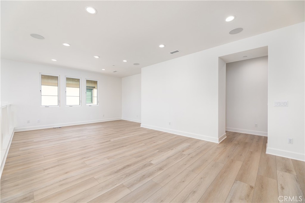 108 Coldwater Irvine, CA 92602 - Photo 25 of 36 an empty room with wooden floor and windows