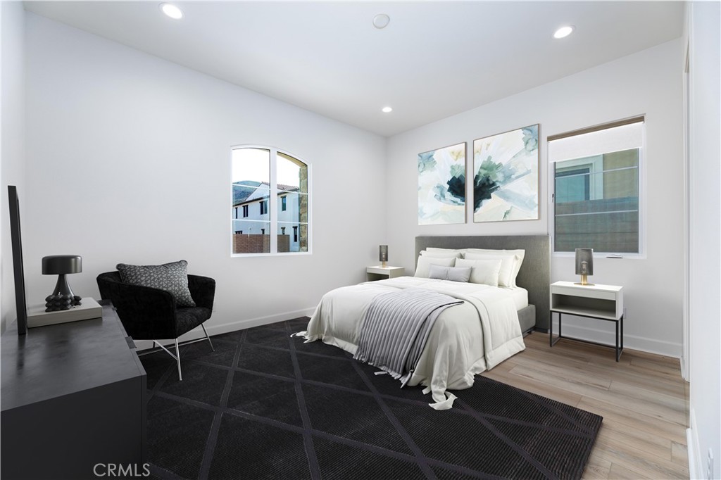 108 Coldwater Irvine, CA 92602 - Photo 27 of 36 a bedroom with a bed and wooden floor