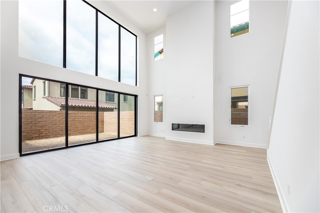 108 Coldwater Irvine, CA 92602 - Photo 32 of 36 a view of a hallway with wooden floor and staircase