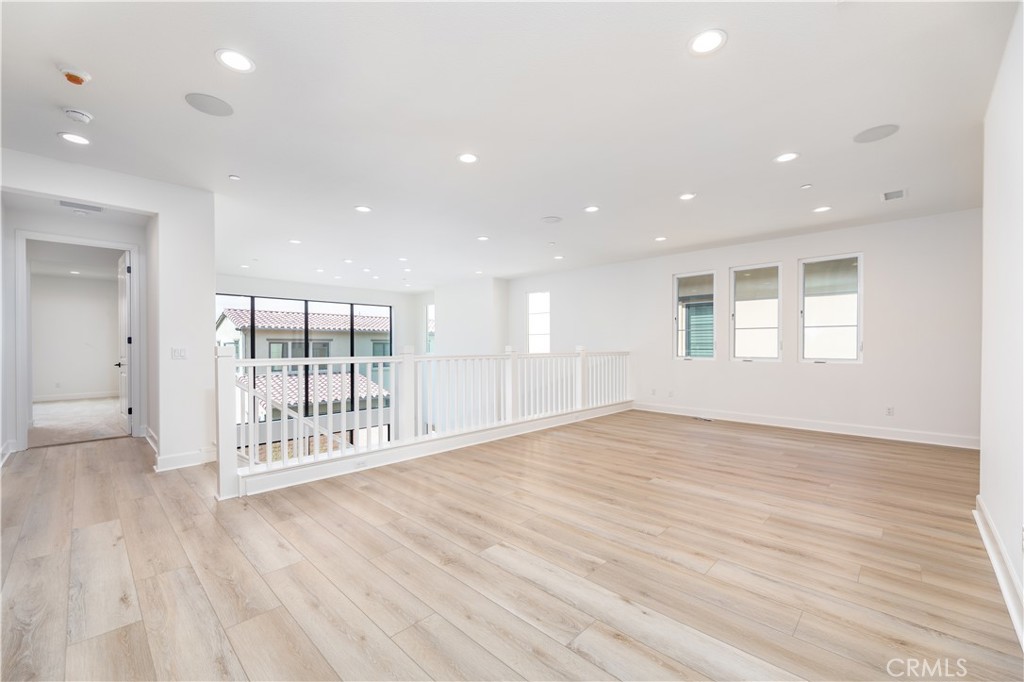108 Coldwater Irvine, CA 92602 - Photo 34 of 36 a view of an empty room with wooden floor and a window