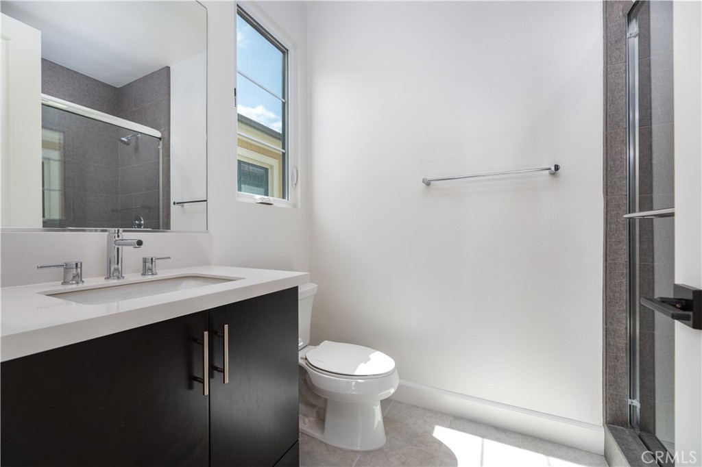 108 Coldwater Irvine, CA 92602 - Photo 6 of 36 a bathroom with a toilet a sink and mirror