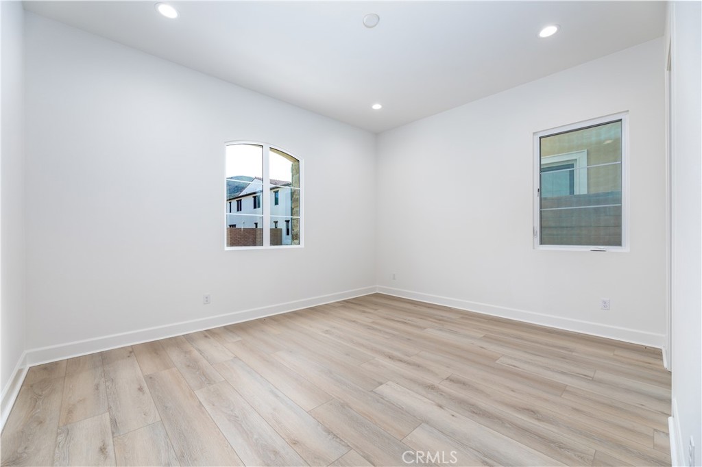 108 Coldwater Irvine, CA 92602 - Photo 7 of 36 an empty room with wooden floor and windows