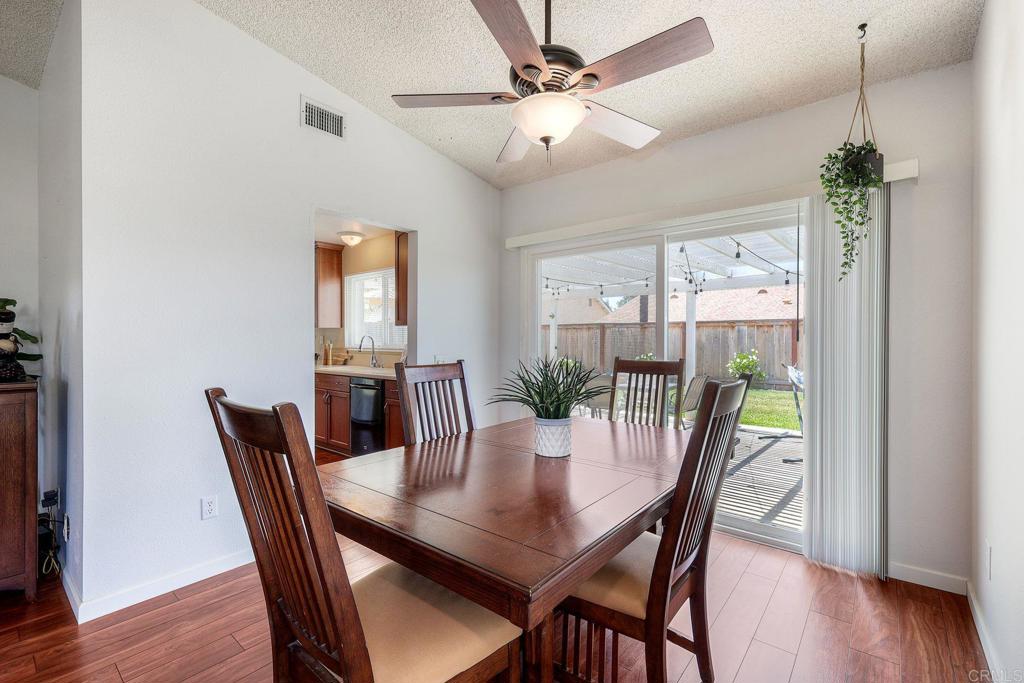 1114 Red Hawk Way San Marcos, CA 92078 - Photo 13 of 59 a view of a dining room with furniture window and wooden floor