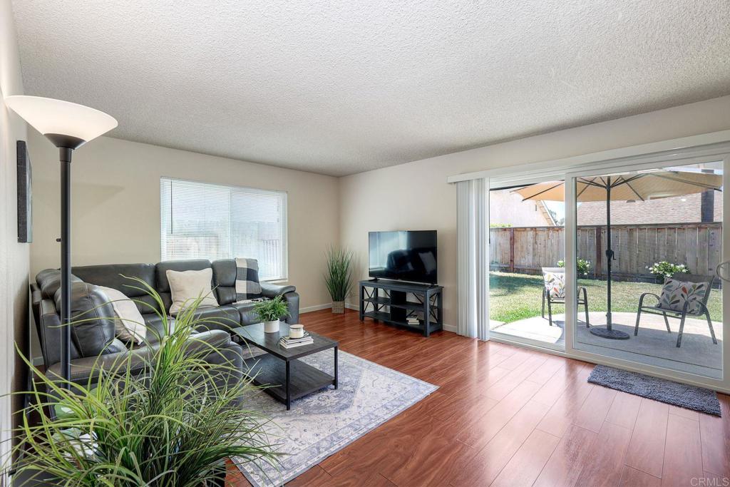 1114 Red Hawk Way San Marcos, CA 92078 - Photo 19 of 59 a living room with furniture and a flat screen tv
