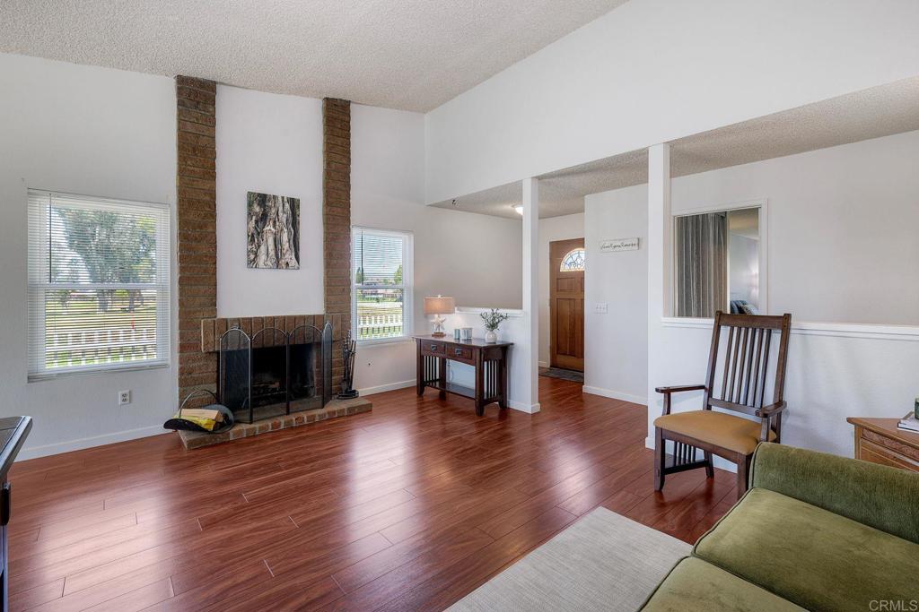 1114 Red Hawk Way San Marcos, CA 92078 - Photo 23 of 59 a living room with furniture and a fireplace