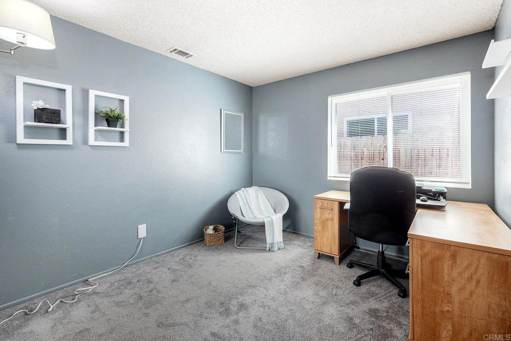 1114 Red Hawk Way San Marcos, CA 92078 - Photo 26 of 59 a view of a workspace with furniture and a window