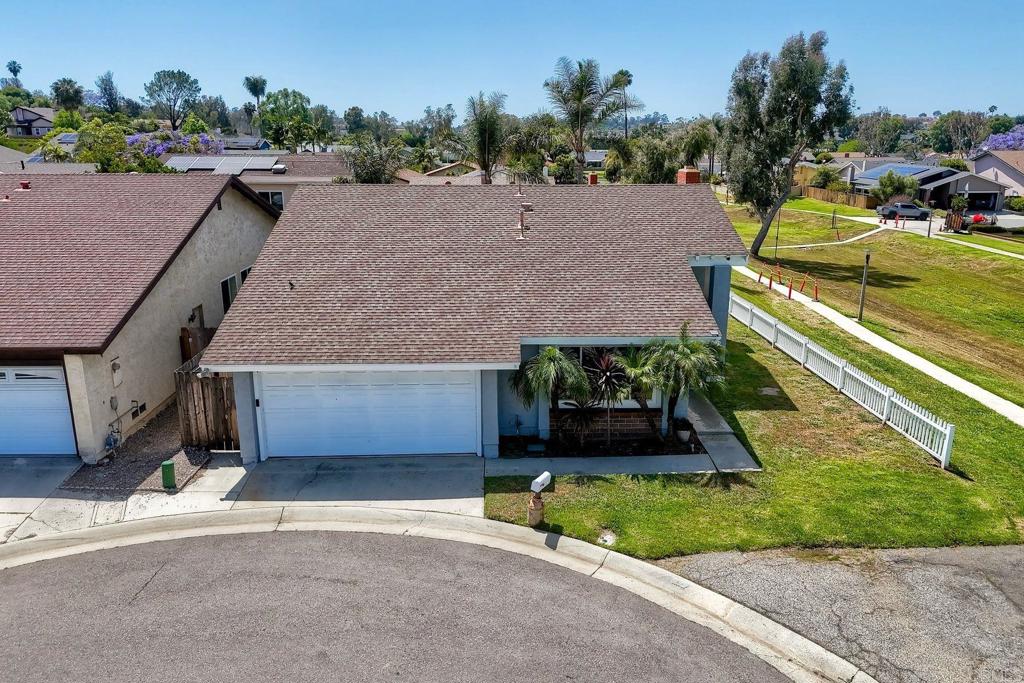1114 Red Hawk Way San Marcos, CA 92078 - Photo 3 of 59 an aerial view of a house with a garden and parking space