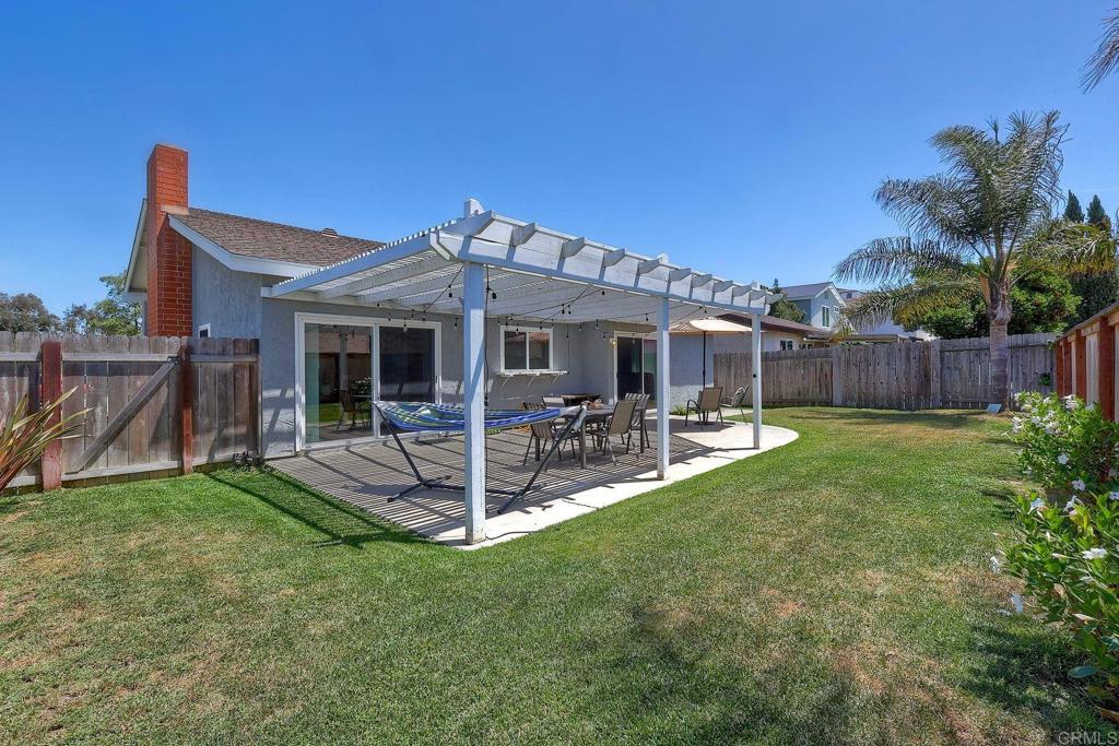 1114 Red Hawk Way San Marcos, CA 92078 - Photo 32 of 59 a front view of a house with a yard garden
