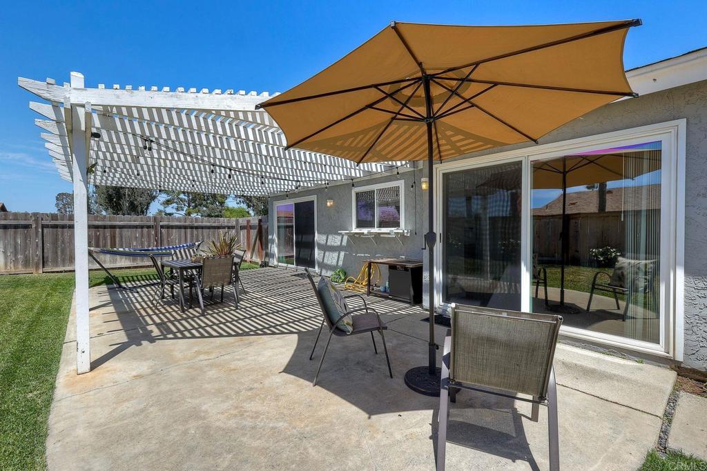 1114 Red Hawk Way San Marcos, CA 92078 - Photo 35 of 59 a view of a patio with a table and chairs under an umbrella
