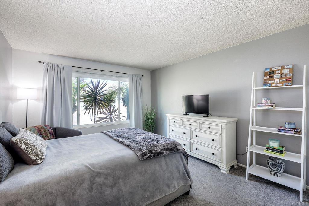1114 Red Hawk Way San Marcos, CA 92078 - Photo 36 of 59 a bedroom with a large bed and a tv
