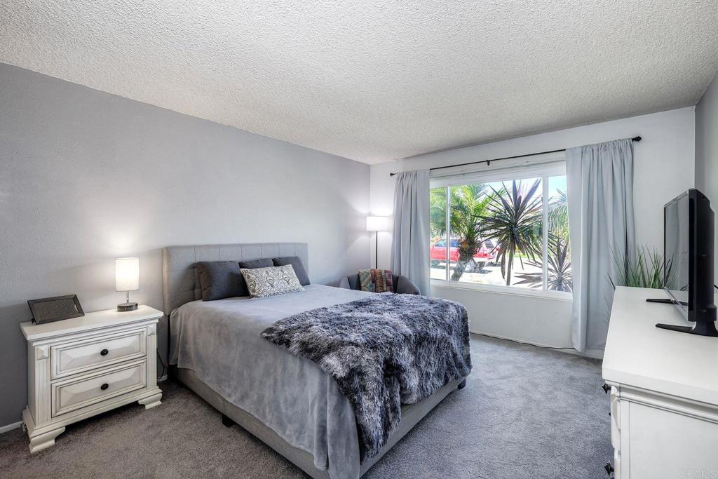 1114 Red Hawk Way San Marcos, CA 92078 - Photo 37 of 59 a bedroom with a bed and a flat tv screen on dresser