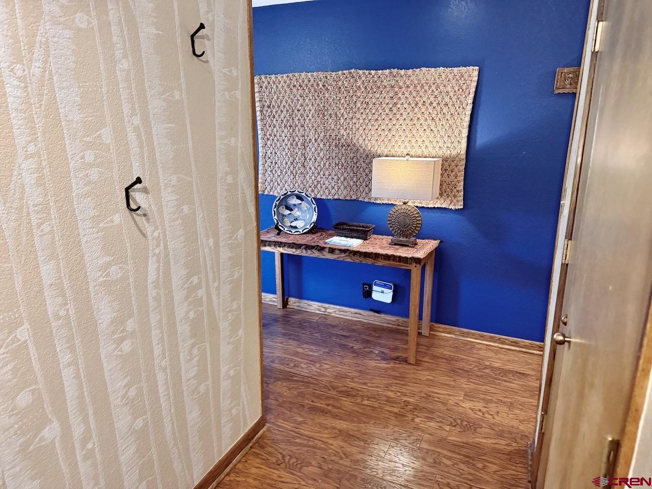 11 Snowmass Road, Unit 337 Crested Butte, CO 81225 - Photo 17 of 35 a room with a table and a mirror