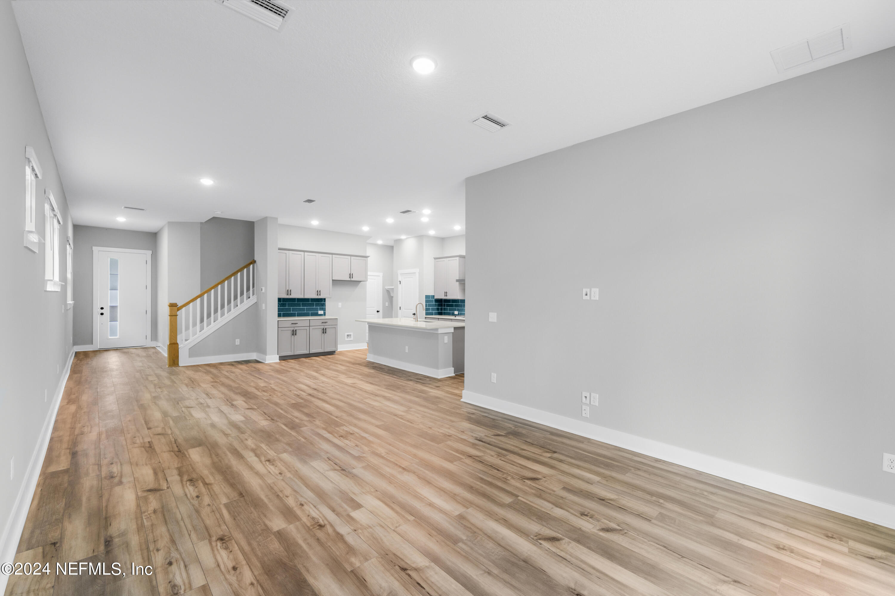 10021 Element Road Jacksonville, FL 32256 - Photo 11 of 18 a view of a kitchen with a sink and wooden floor