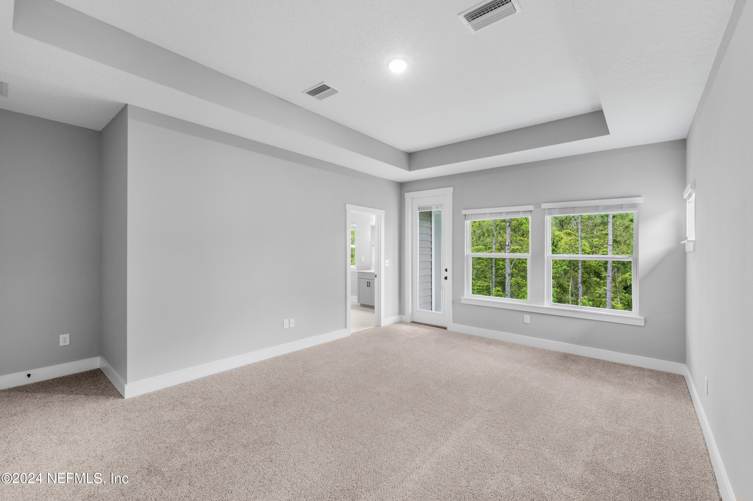 10021 Element Road Jacksonville, FL 32256 - Photo 15 of 18 a view of an empty room with a window