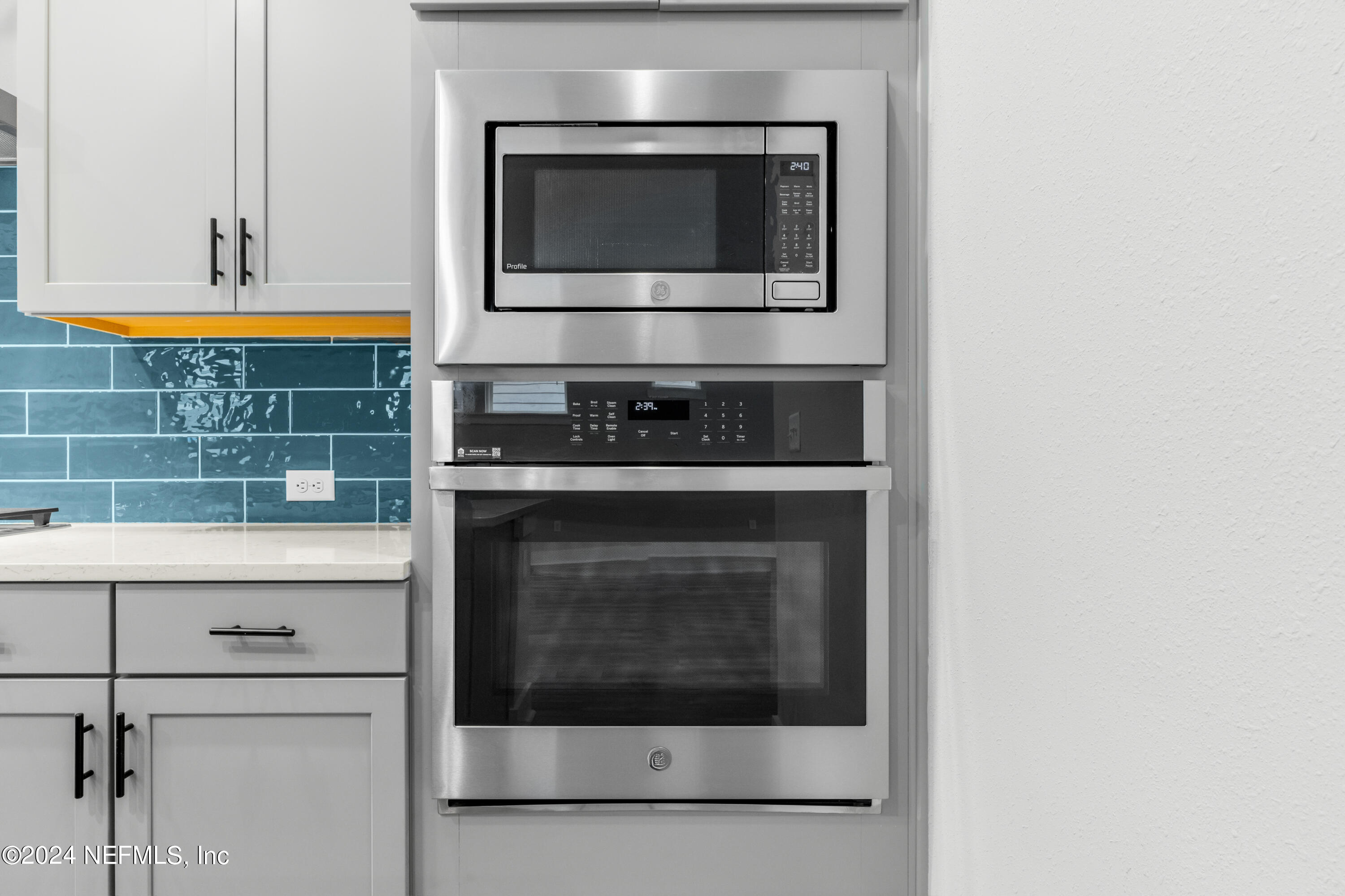 10021 Element Road Jacksonville, FL 32256 - Photo 7 of 18 a stove top oven sitting inside of a kitchen