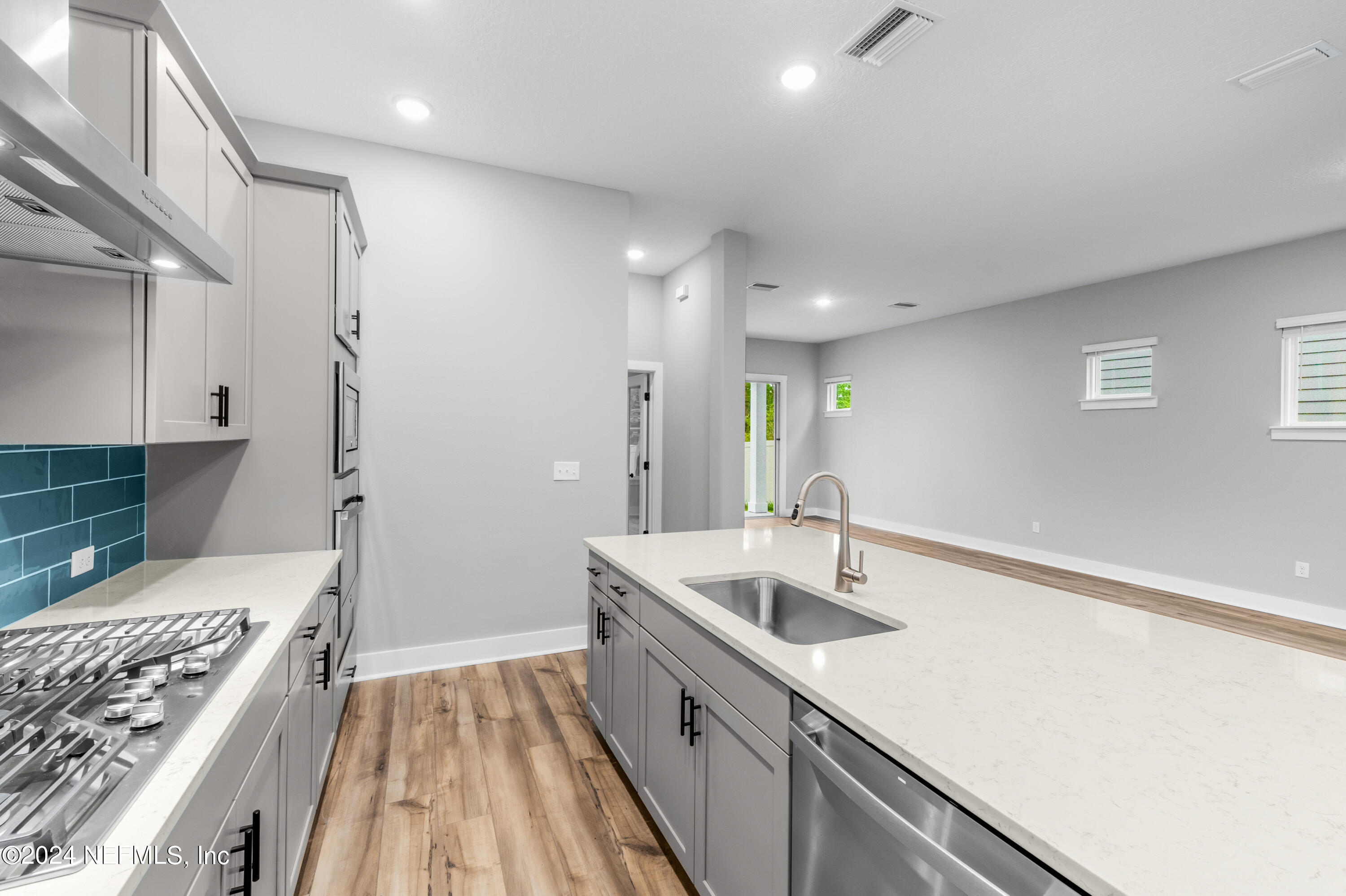 10021 Element Road Jacksonville, FL 32256 - Photo 8 of 18 a bathroom with a sink and a large mirror