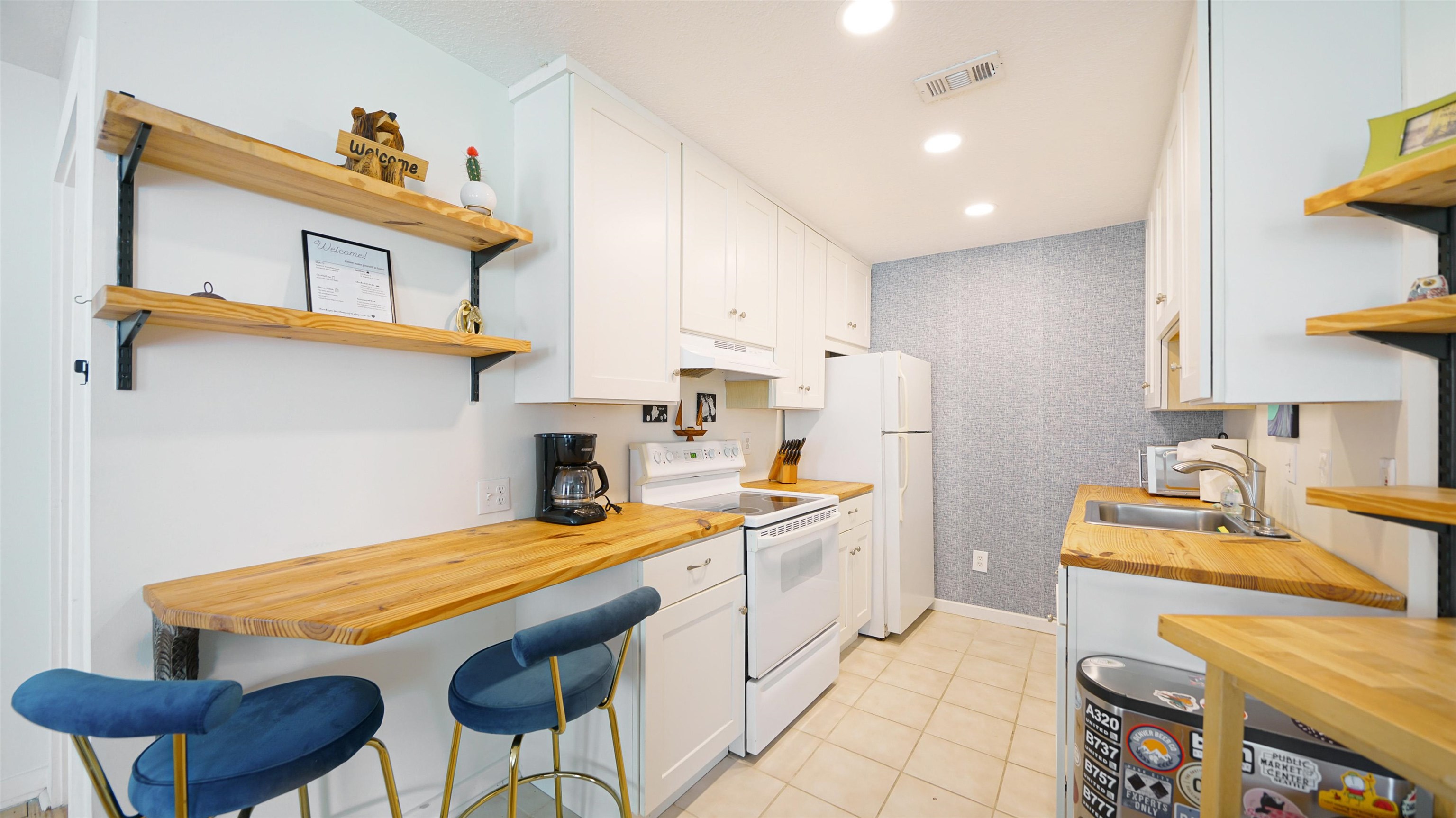 119 Moore Street St. Augustine, FL 32084 - Photo 25 of 49 a kitchen with stainless steel appliances granite countertop a sink a stove and a refrigerator