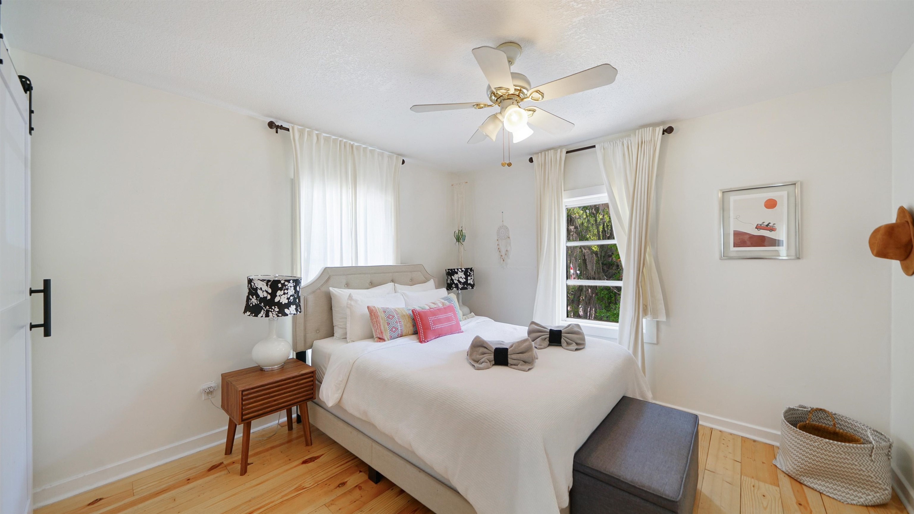 119 Moore Street St. Augustine, FL 32084 - Photo 27 of 49 a bedroom with a bed and a chandelier