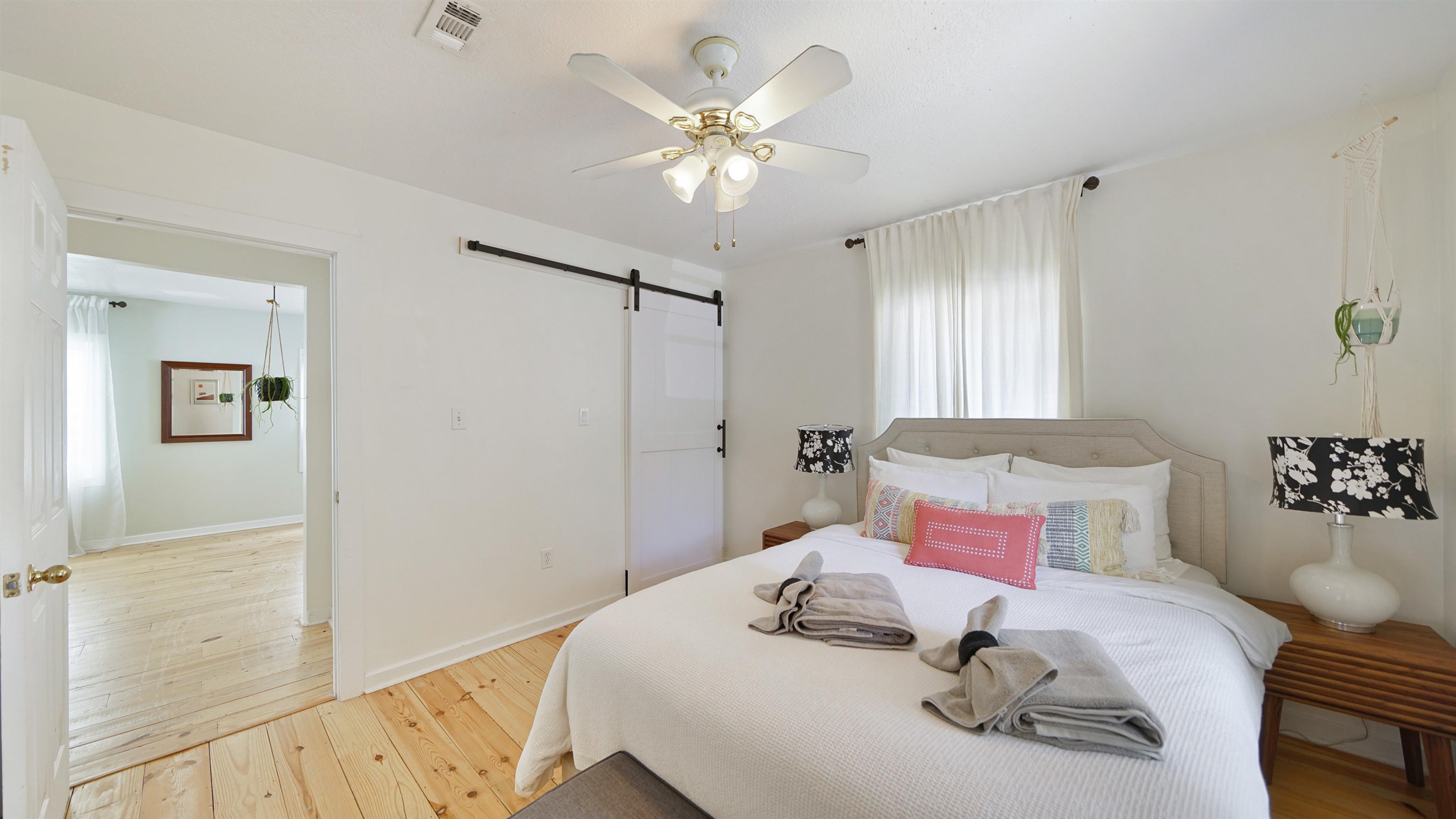 119 Moore Street St. Augustine, FL 32084 - Photo 28 of 49 a bedroom with a bed and a chandelier