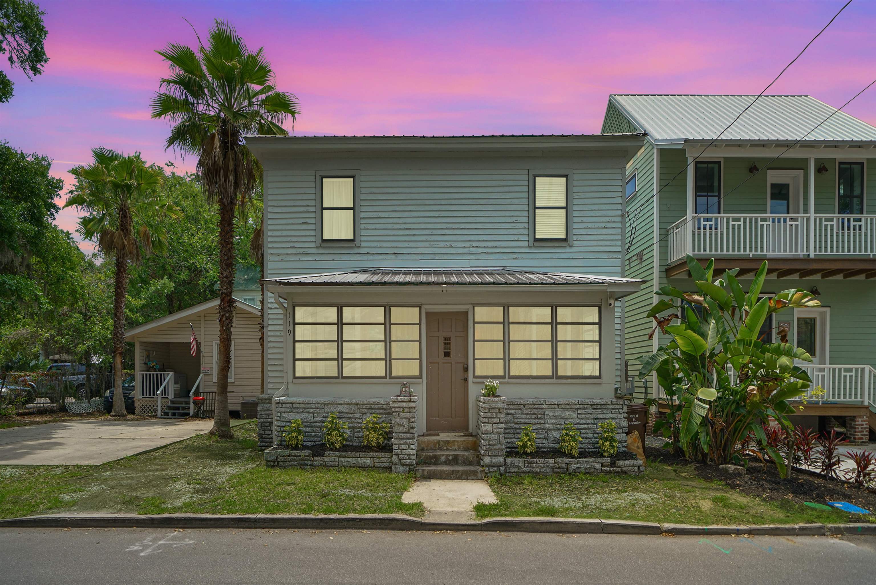 119 Moore Street St. Augustine, FL 32084 - Photo 43 of 49 a front view of a house with a yard and garage
