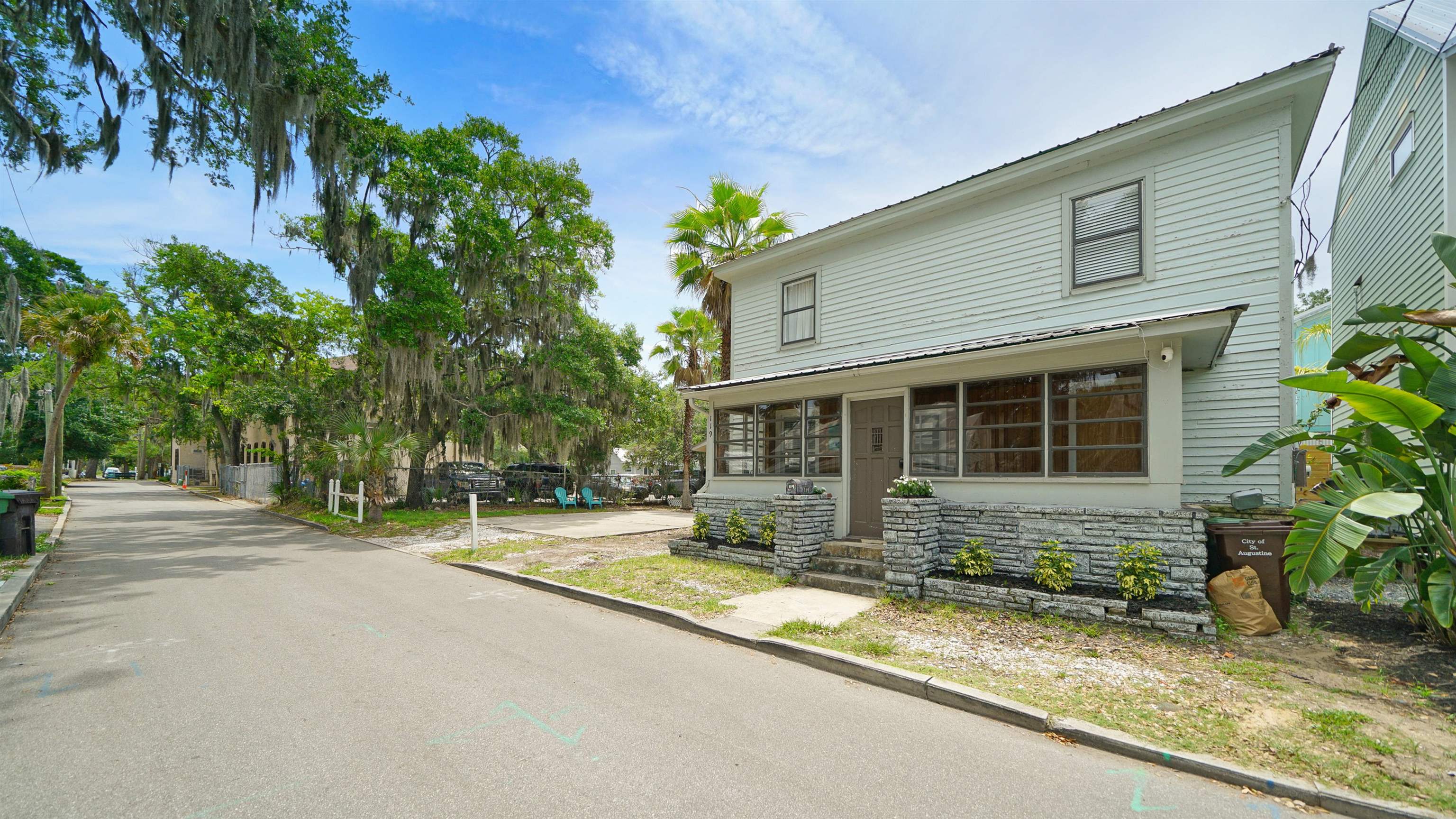 119 Moore Street St. Augustine, FL 32084 - Photo 45 of 49 a front view of a house with garden