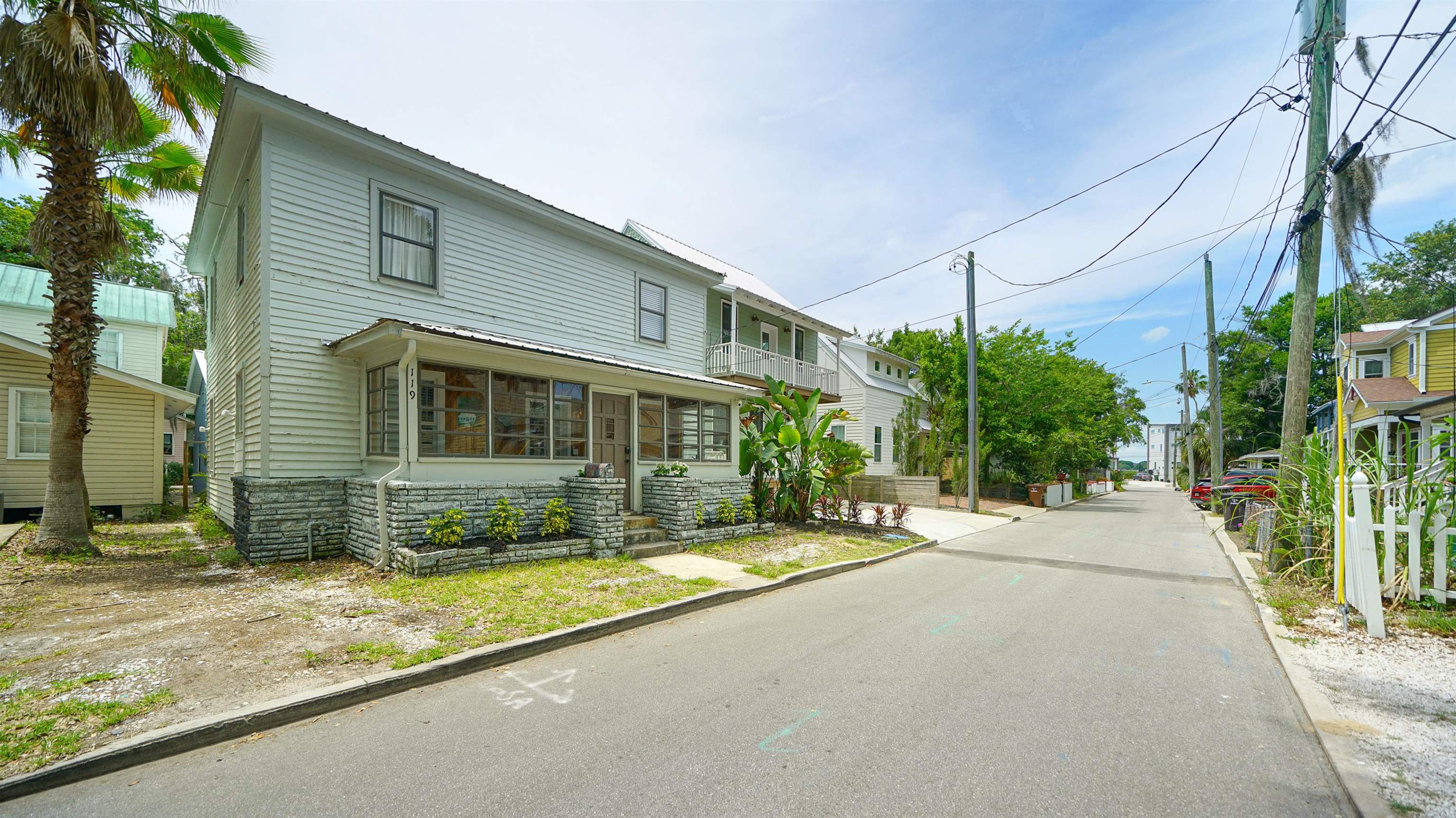 119 Moore Street St. Augustine, FL 32084 - Photo 46 of 49 a view of a house with a small yard and potted plants