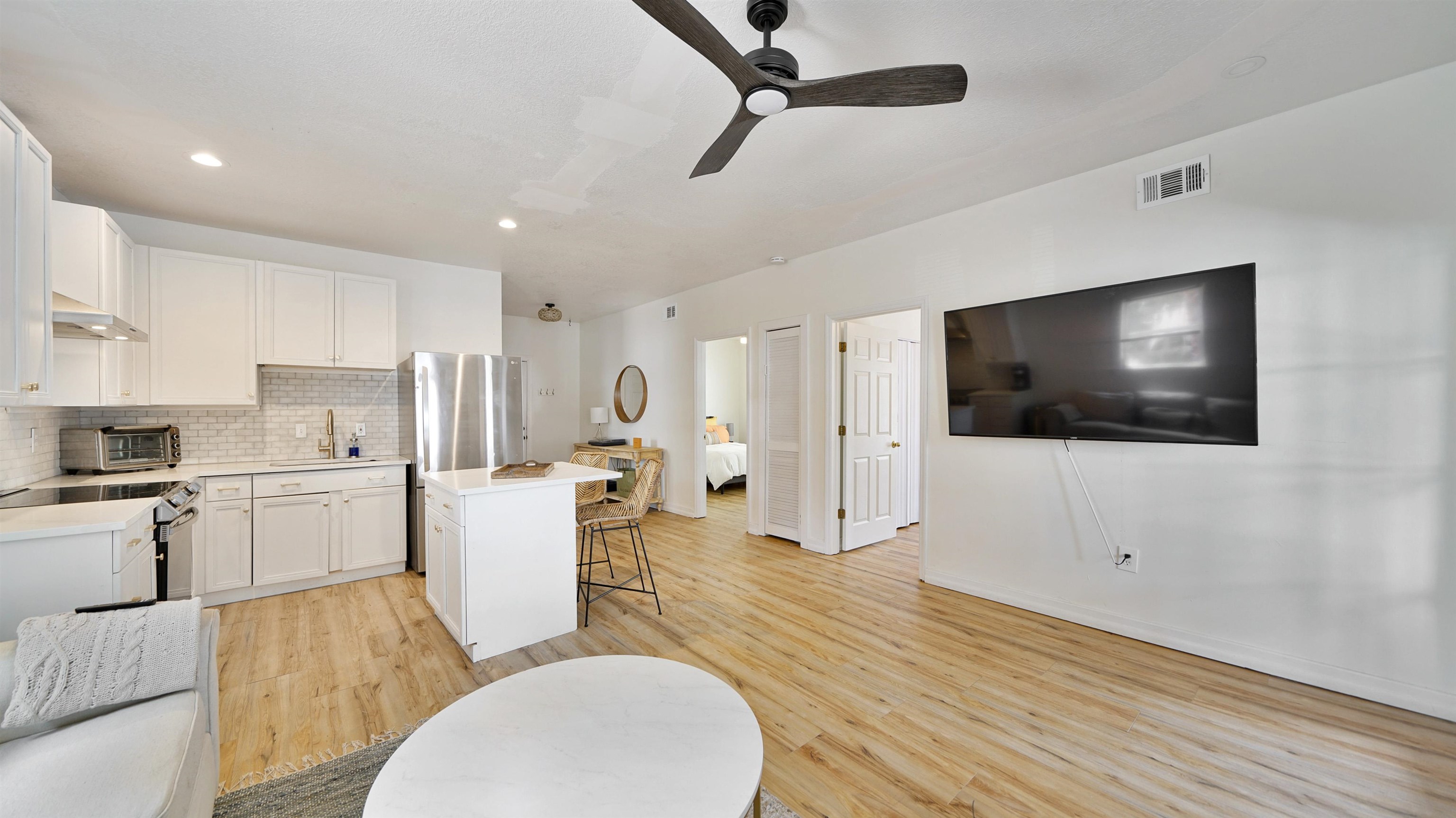 119 Moore Street St. Augustine, FL 32084 - Photo 7 of 49 a living room with furniture and a flat screen tv