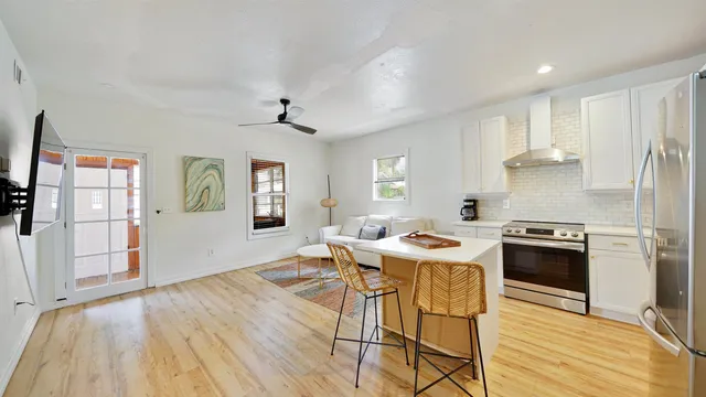 a view of a dining room with furniture and wooden floor