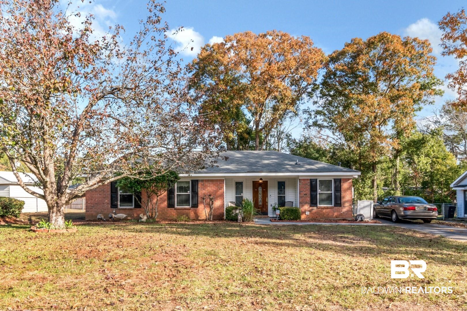 9360 Burnt Tree Drive Mobile, AL 36695 - Photo 27 of 28 Ranch-style home featuring a front lawn and a porch