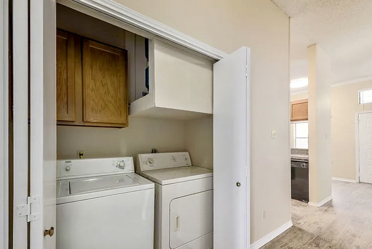 2802 Nueces Street, Unit 211 Austin, TX 78705 - Photo 14 of 14 a utility room with dryer and washer