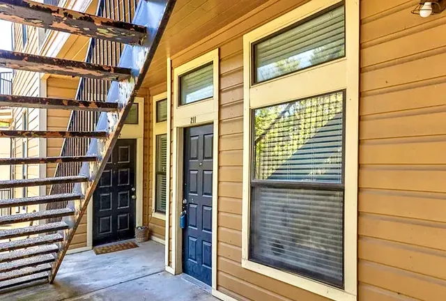 a view of front door with stairs